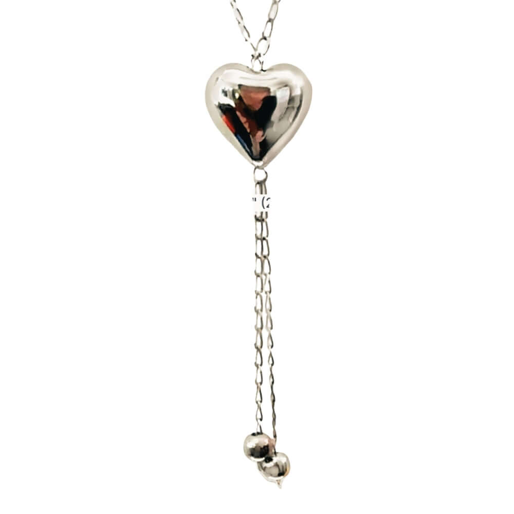 Close-up view of the polished sterling silver heart focal piece and the fluid accent drops below.