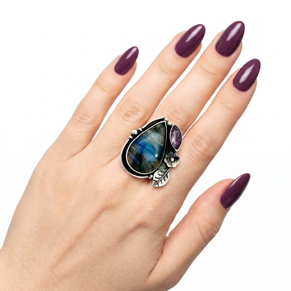 High-purity silver split-band chunky ring with gemstones shown on a hand to illustrate its scale and adjustable size 7 fit.