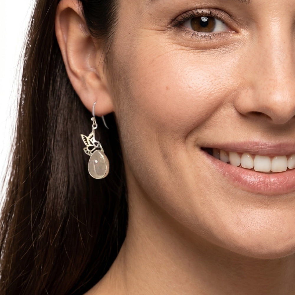 A model wearing the authentic Mexican silver hummingbird drops, showing how they instantly elevate a casual everyday style.
