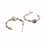 Two authentic Mexican silver hoop earrings with amethyst gemstones showing the delicate handcrafted texture