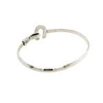 Rear lay of the solid silver bracelet demonstrating the clean, tapered band construction and flawless polish.