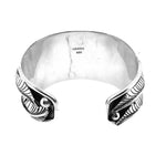 Rear lay of the wide silver cuff demonstrating the clean, premium open-back construction and flawless interior polish.