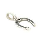 Silver horseshoe charm on a white background
