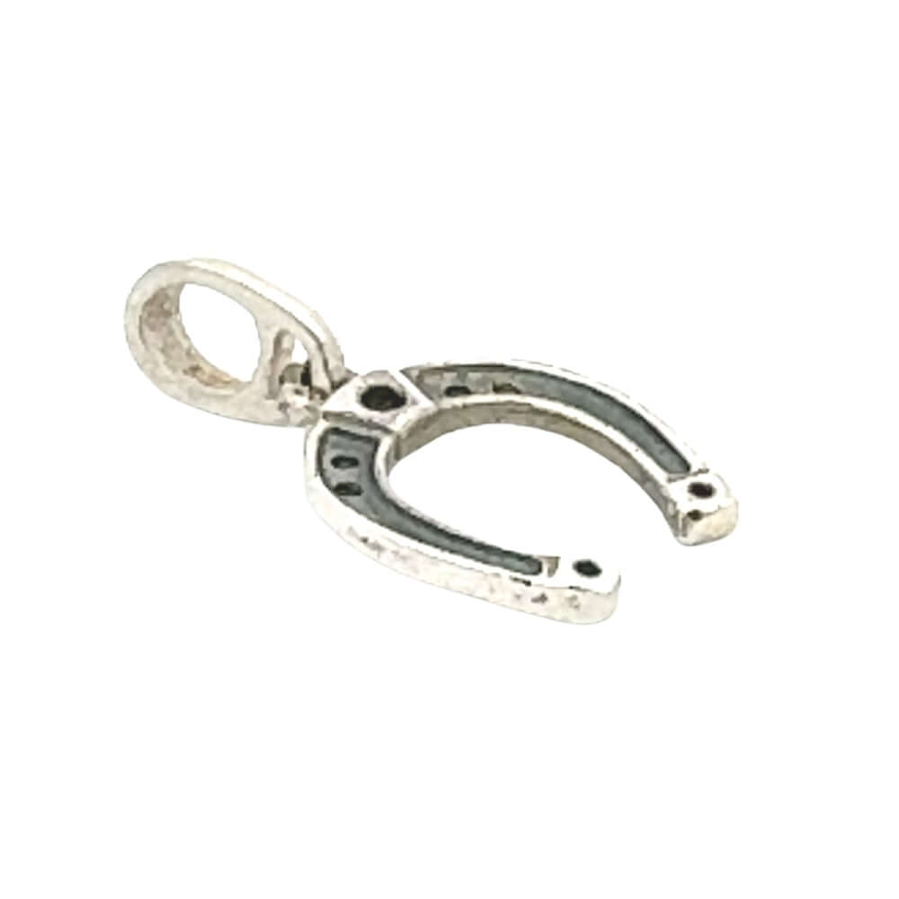 Silver horseshoe charm on a white background