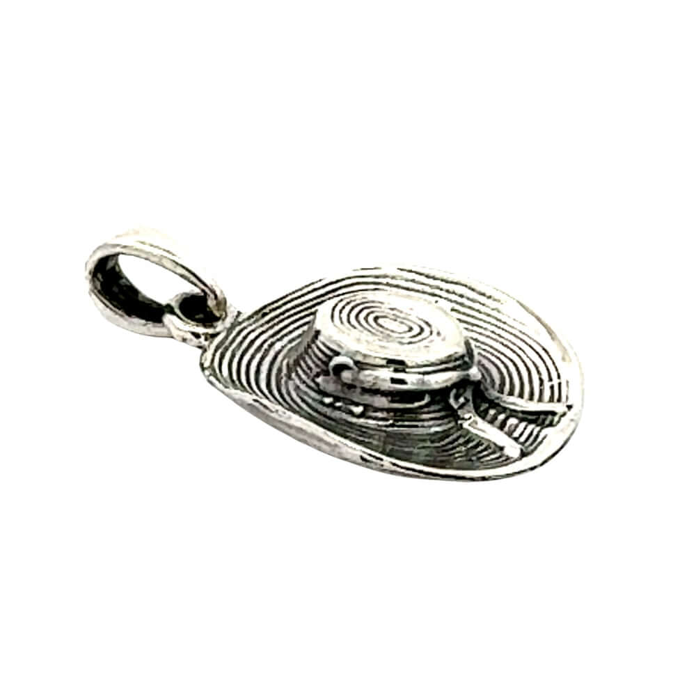 Profile view of the textured silver cowgirl hat pendant showing the smooth crown contours and integrated hanging bail hardware.