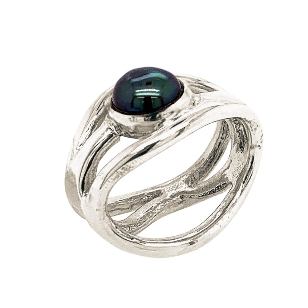 Side perspective view showcasing the clean contours of the openwork frame and the smooth bezel setting of the dark pearl cabochon.
