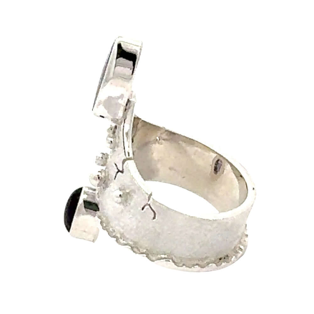 Side view highlighting the textured band and intentional artisan cracks of the handmade Taxco ring.
