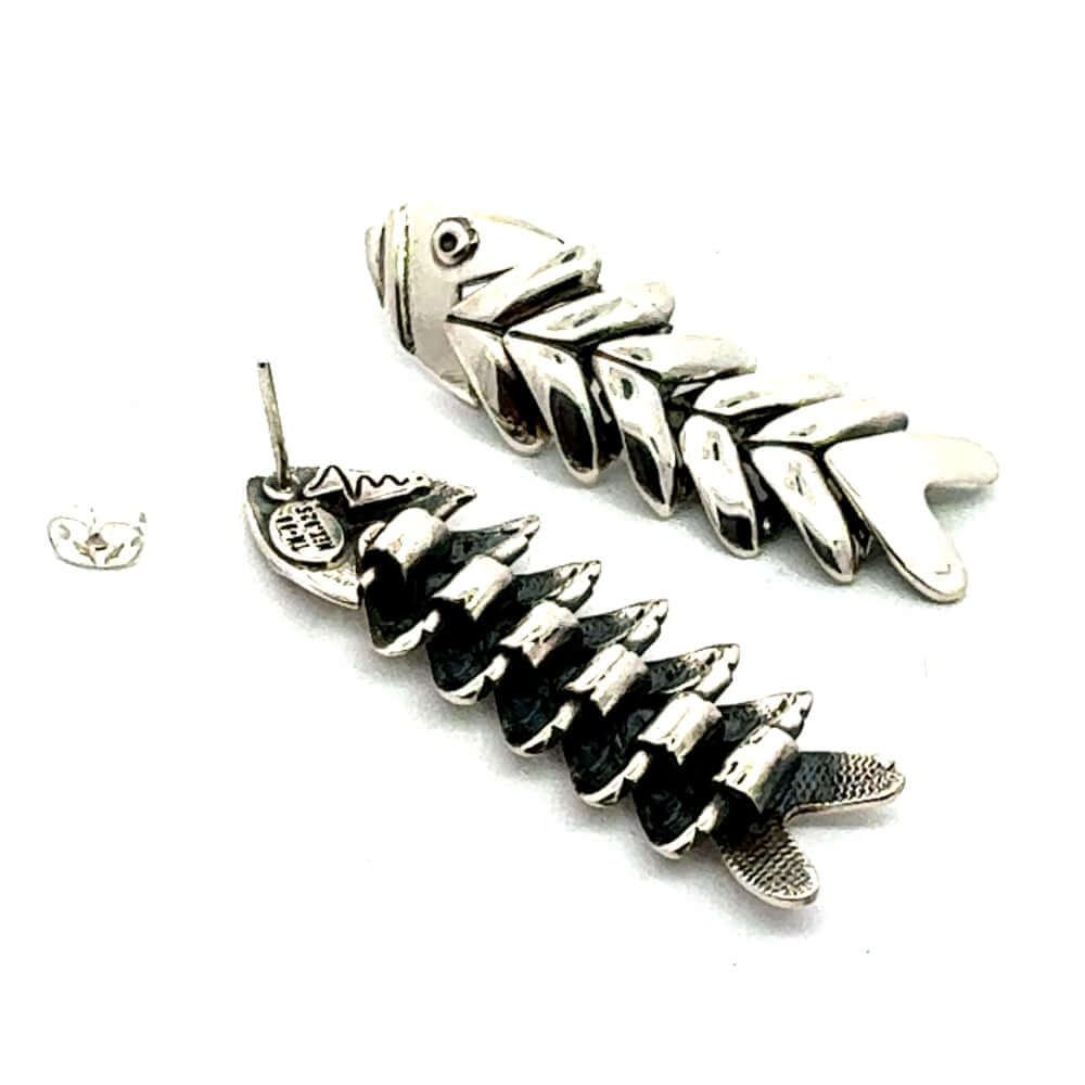 Front and back view of DMolina silver fishbone post earrings.