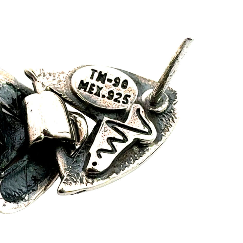 Close-up of TM-90 MEX .925 stamp and DMolina signature hallmark.