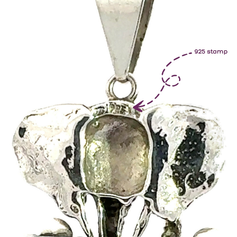 Close-up macro view highlighting the official .925 purity stamp etched onto the reverse side of the sterling silver elephant frame.