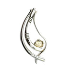 Front view of a handmade .925 sterling silver openwork pendant featuring a rectangular citrine gemstone.