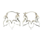 Pair of silver hoop earrings on a white background