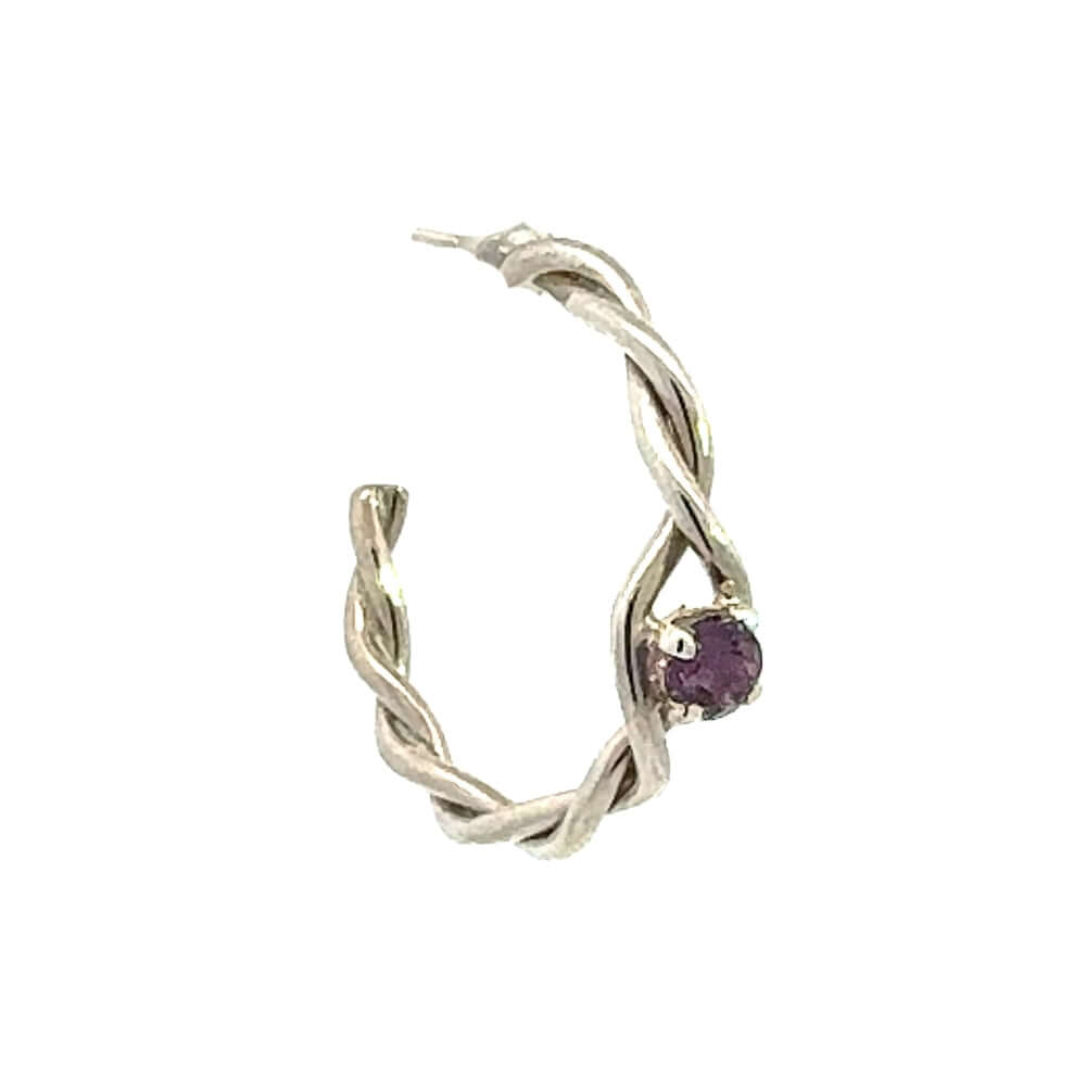 Detailed side view of a fine hand-forged twisted silver hoop earring featuring a round amethyst setting