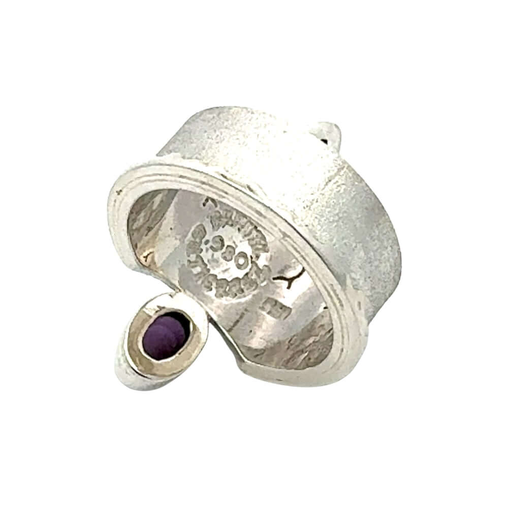 Rear angle of the broad-banded statement ring illustrating the smooth, high-purity silver craftsmanship.
