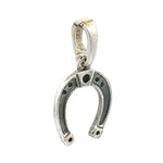 Silver horseshoe pendant on a white background