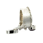 Elevated top-down view displaying the contrast between the polished silver dripping edge and the matte textured band.