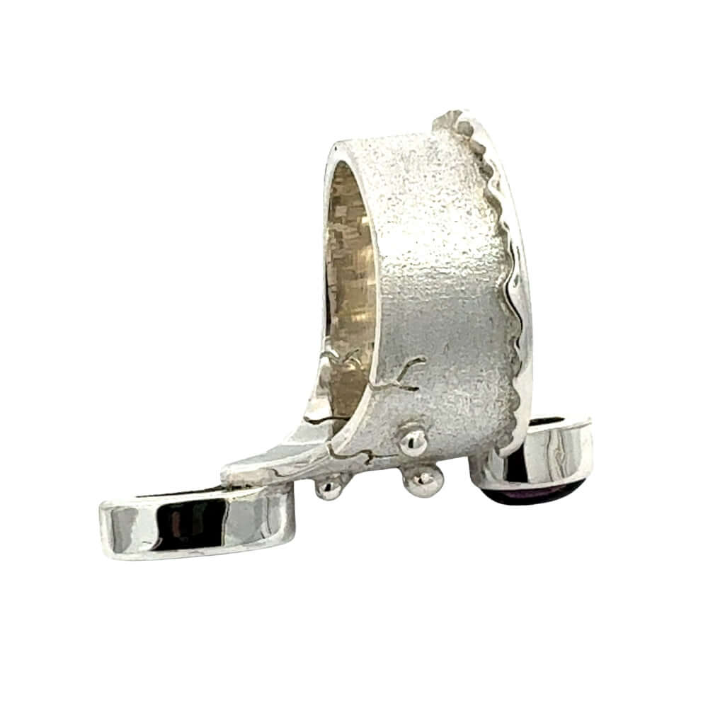 Elevated top-down view displaying the contrast between the polished silver dripping edge and the matte textured band.
