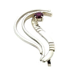 Reverse view showing the elegant curves of an artisan silver garnet pendant