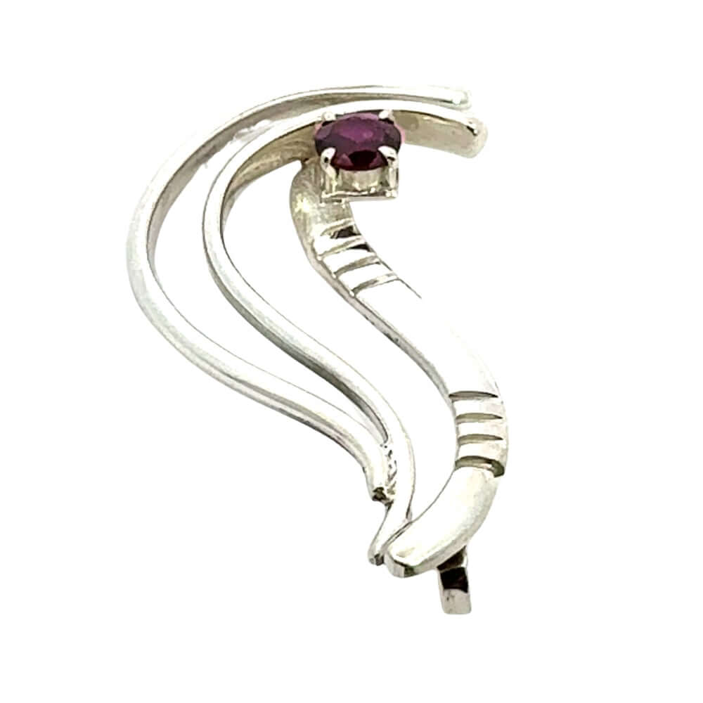 Reverse view showing the elegant curves of an artisan silver garnet pendant