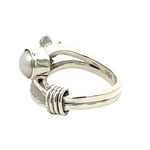 Side profile of the Daniel Gutierrez silver ring highlighting the raised flower and pearl setting.