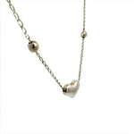 Necklace with a heart-shaped pendant on a white background