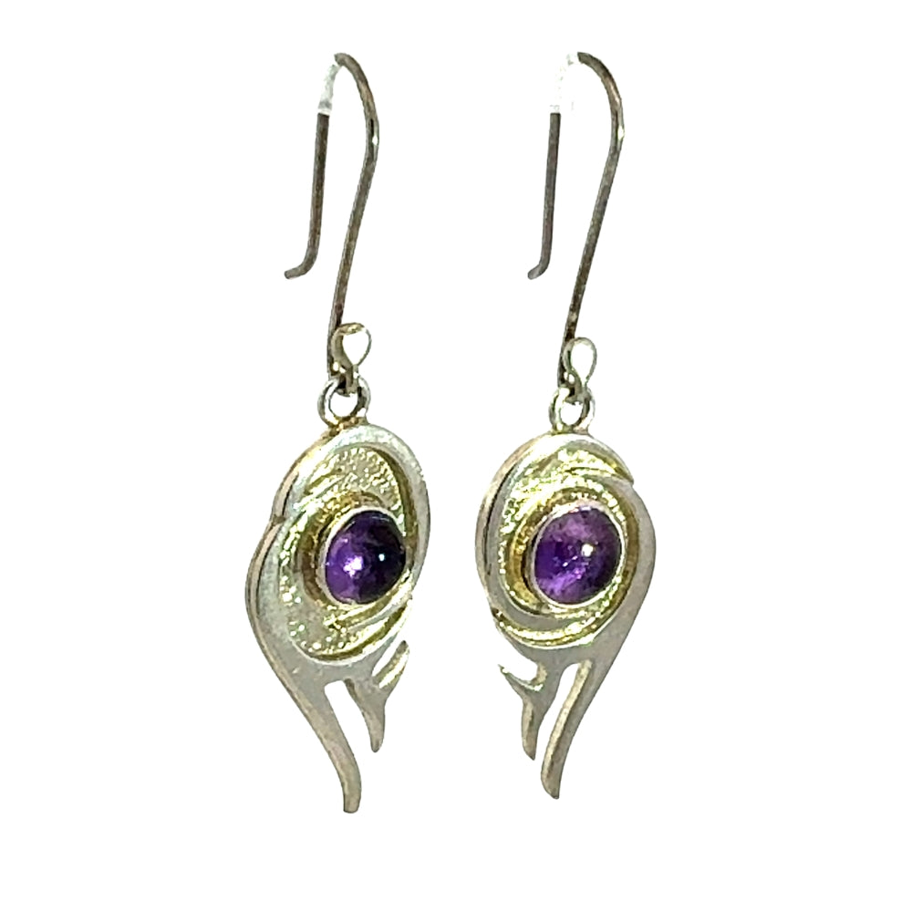 Handcrafted 925 silver drop earrings featuring a flame conch silhouette and textured surround around purple amethyst.