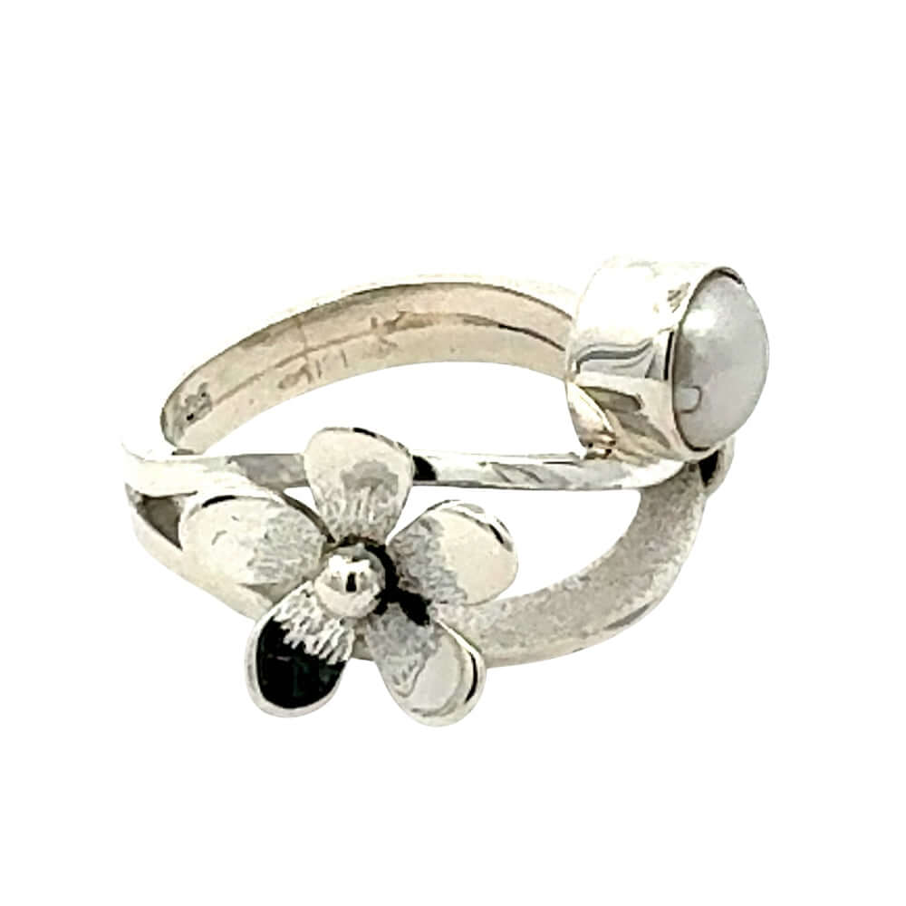 Detailed view of the textured silver petals and 925 hallmark on a handmade ring.