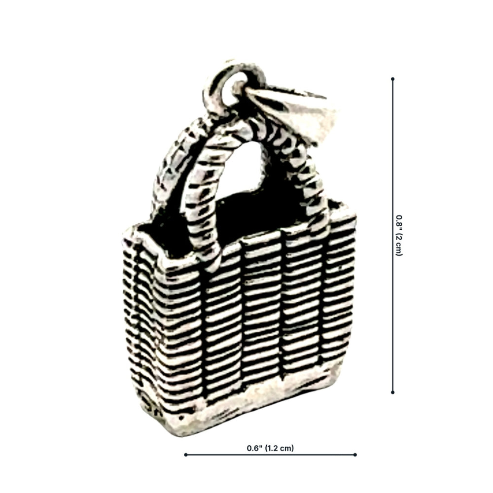 Silver woven market bag charm with dimensions labeled: 0.6 inches wide, 0.8 inches tall