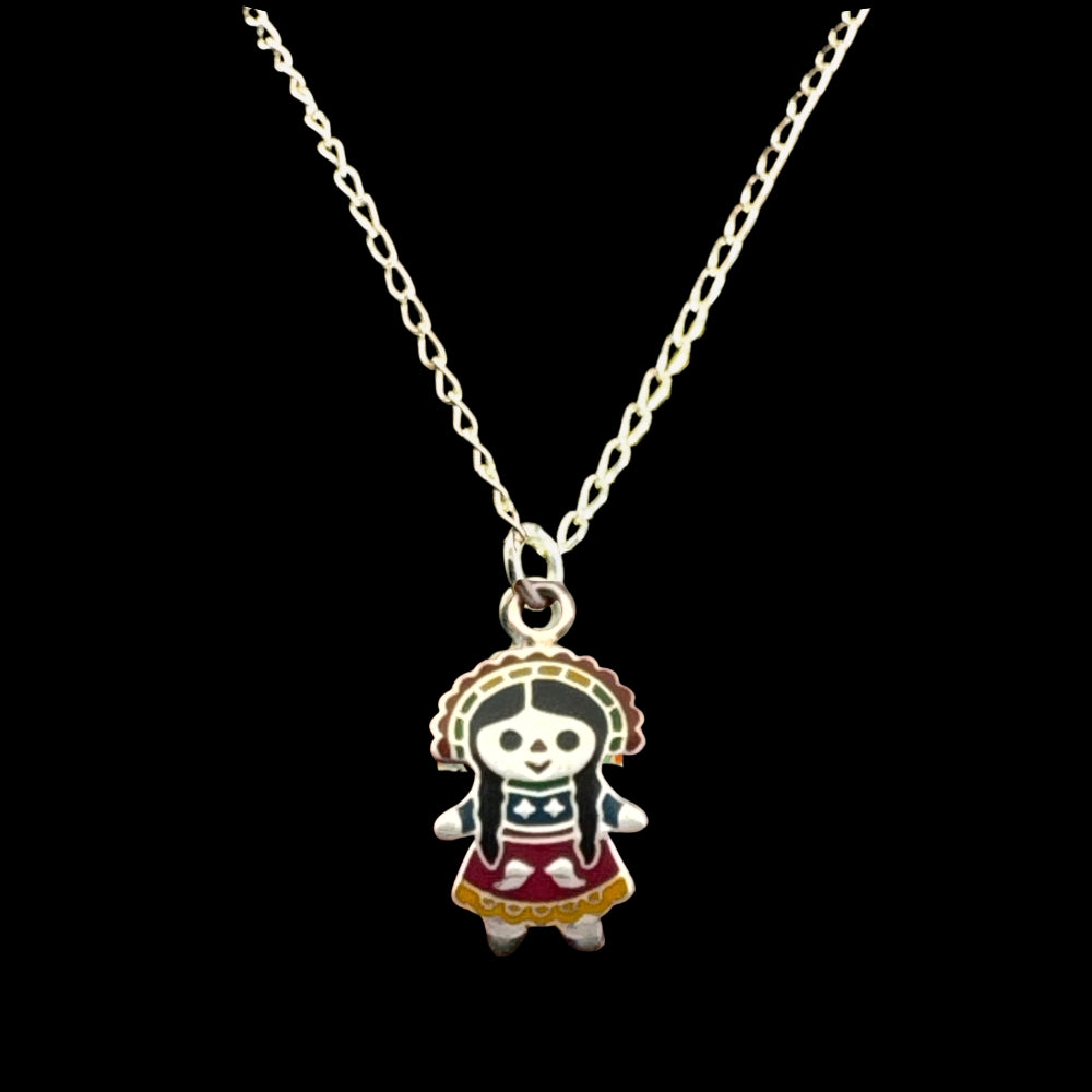 Sterling silver enamel Muñeca María doll pendant necklace, black background