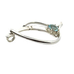 Detailed side view showing the craftsmanship of a handmade silver pendant