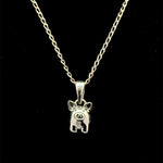 Sterling silver pig pendant necklace with cable chain on black background