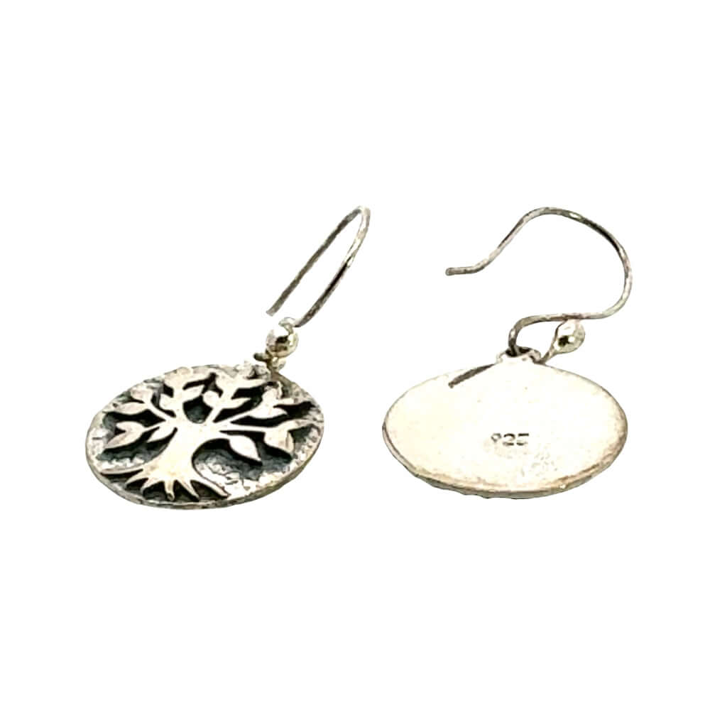 Detailed macro shot of the forged textures on handmade silver tree of life dangles
