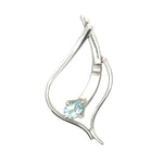 Front view of a unique artisan sterling silver pendant with a blue topaz stone