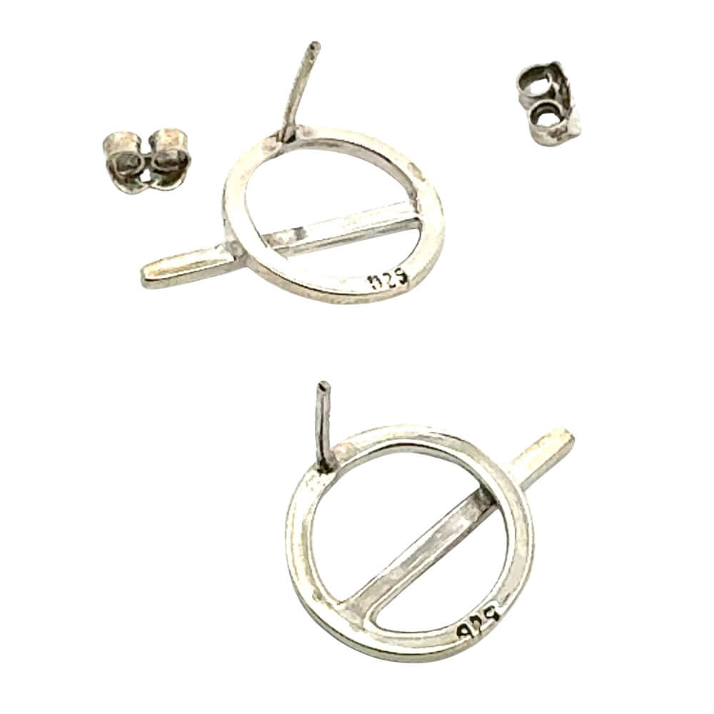 Dynamic shot of sterling silver circle and line earrings showcasing the artistic repeating elements