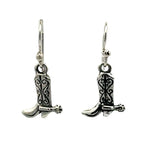 Front view of a pair of handmade 925 sterling silver cowboy boot earrings showcasing intricate oxidized stitching and miniature spur details.