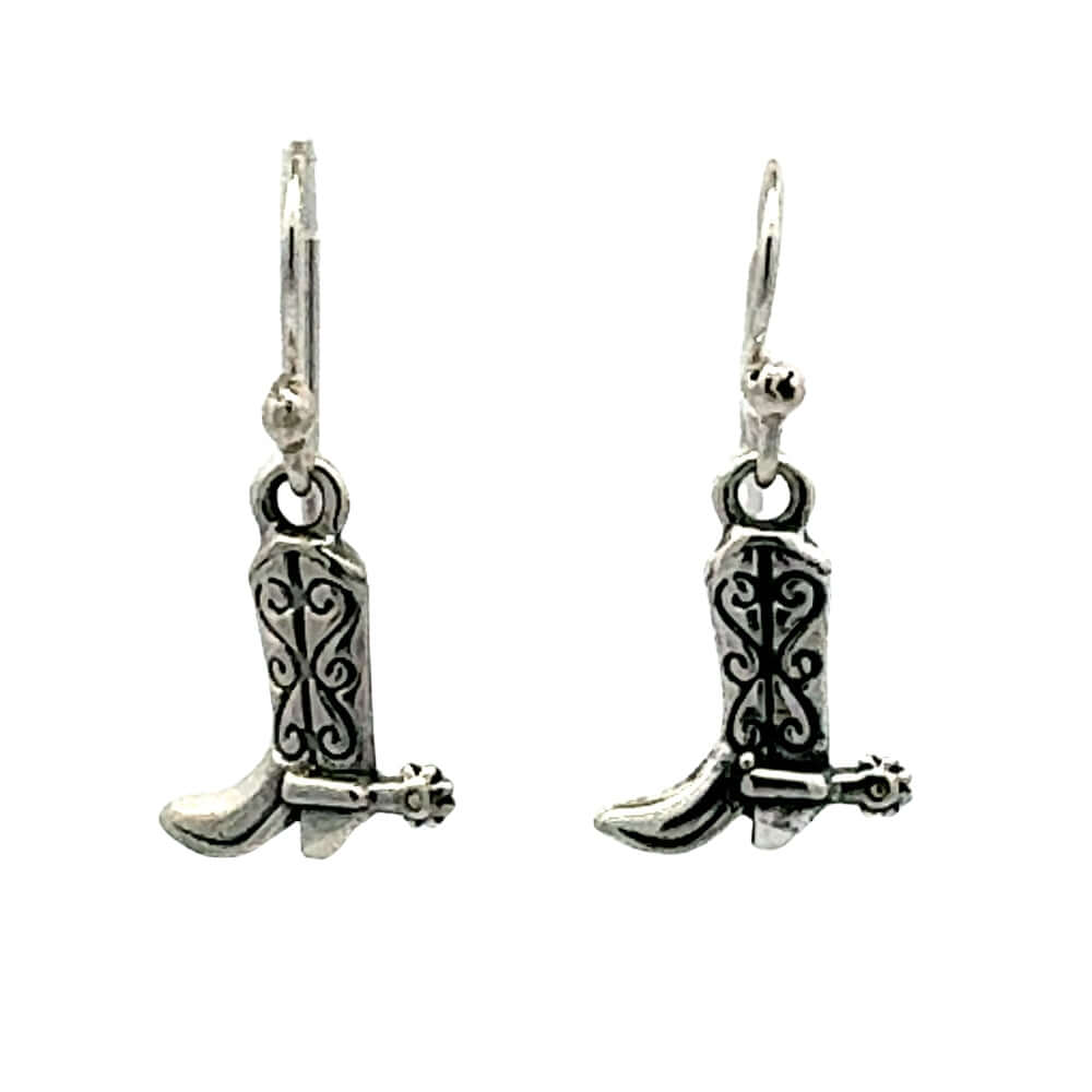 Front view of a pair of handmade 925 sterling silver cowboy boot earrings showcasing intricate oxidized stitching and miniature spur details.