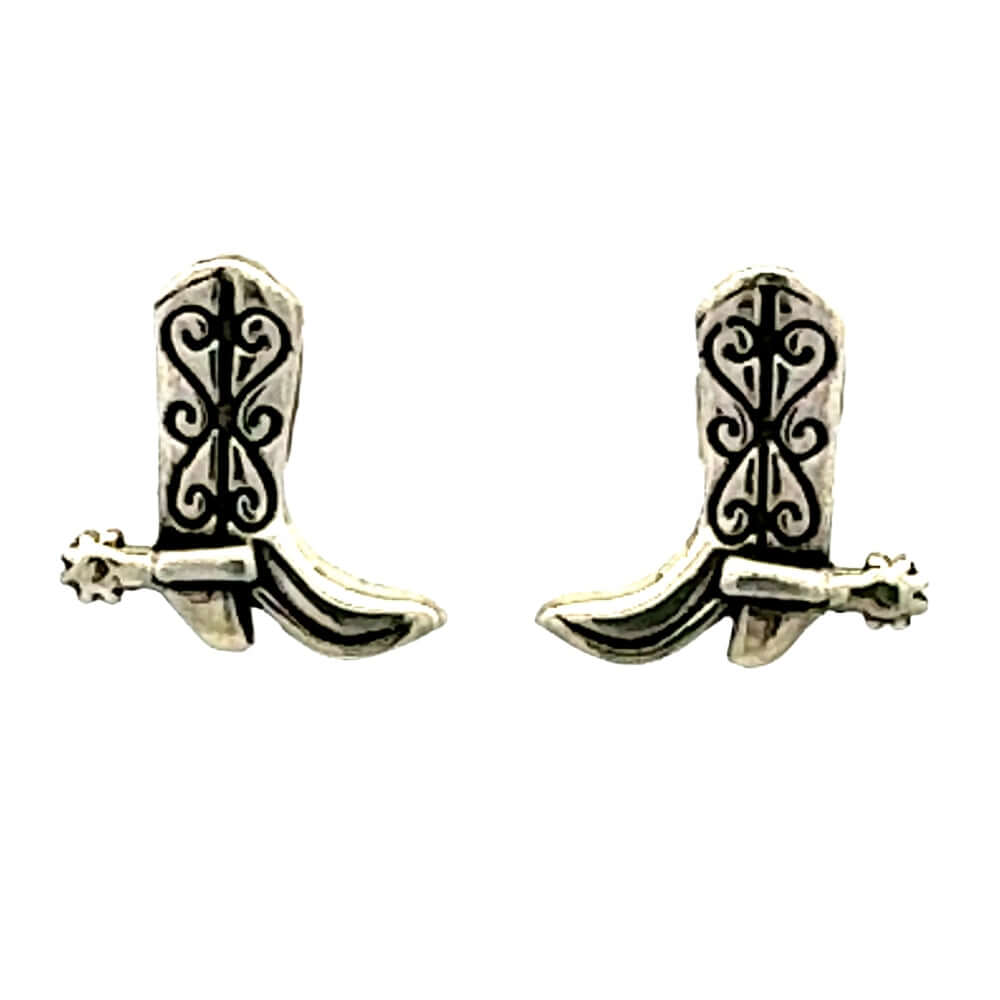 Front view of a pair of handmade 925 sterling silver cowboy boot post earrings showcasing intricate oxidized stitching and miniature spur details.