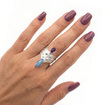 Alternating view of the statement ring on a finger, showcasing how the wide band wraps comfortably around the hand.