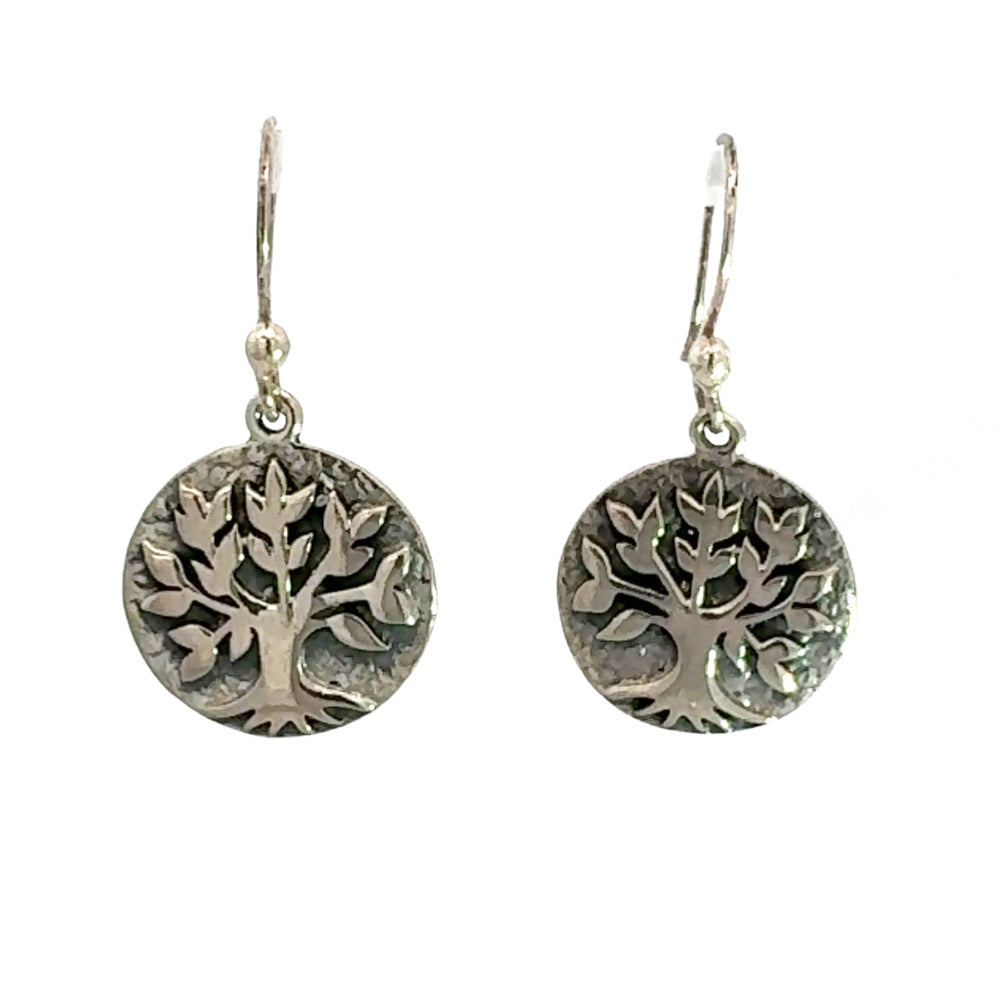 Front view of handmade sterling silver tree of life earrings from Taxco Mexico showing intricate artisan detail
