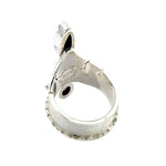 Alternative side profile view showcasing the molten silver border detail and secure gemstone settings.