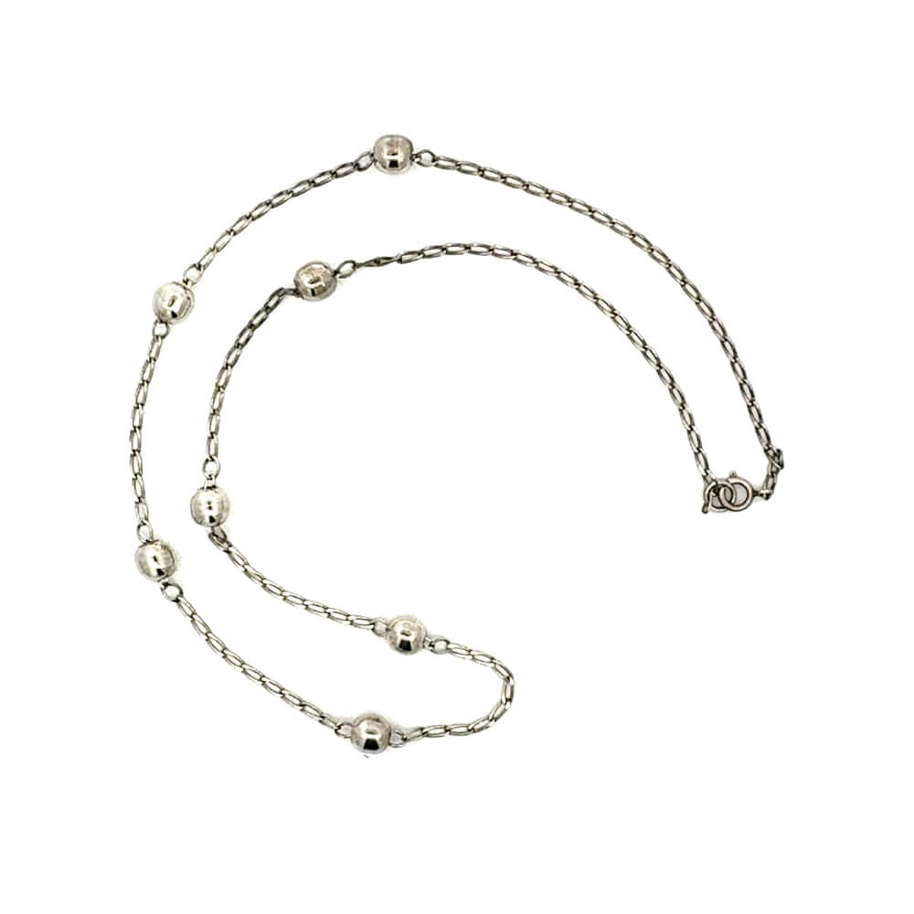 Silver chain necklace on a white background