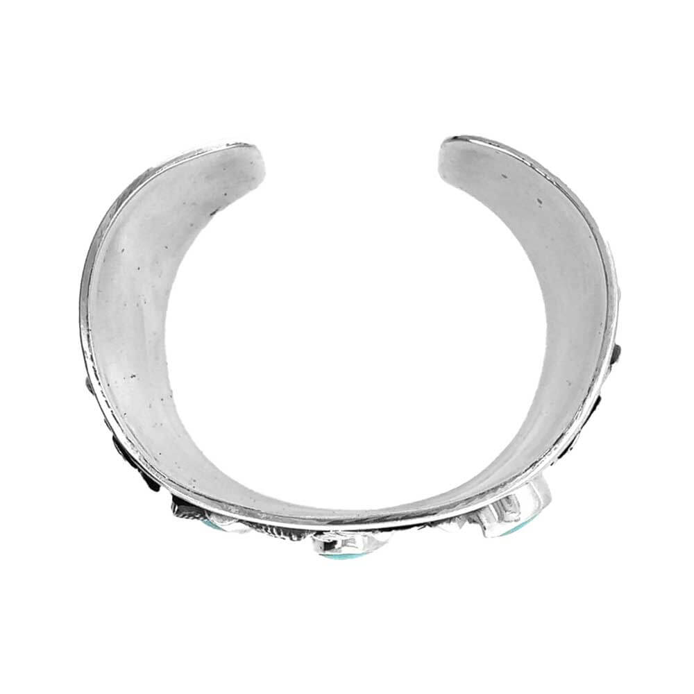 Top view of western turquoise floral silver cuff bracelet