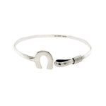 Side perspective showcasing the integrated hook-and-eye security clasp hidden within the horseshoe design.