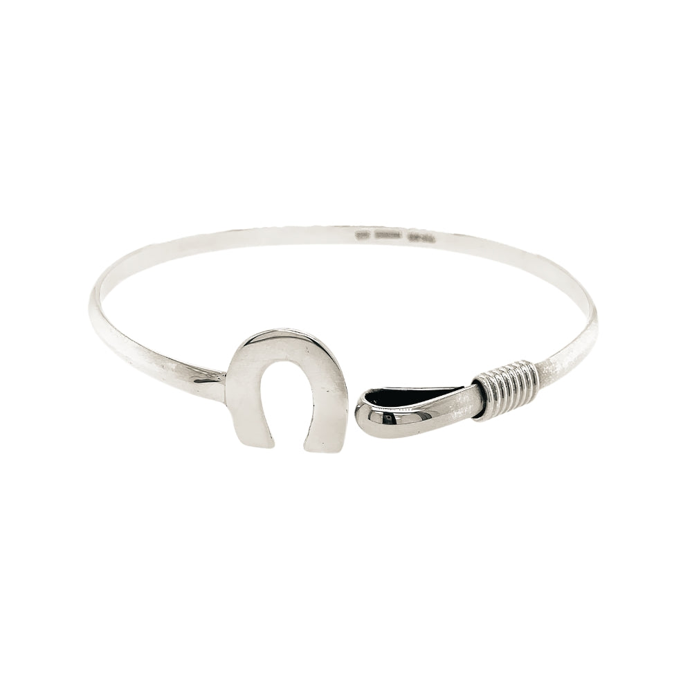 Side perspective showcasing the integrated hook-and-eye security clasp hidden within the horseshoe design.