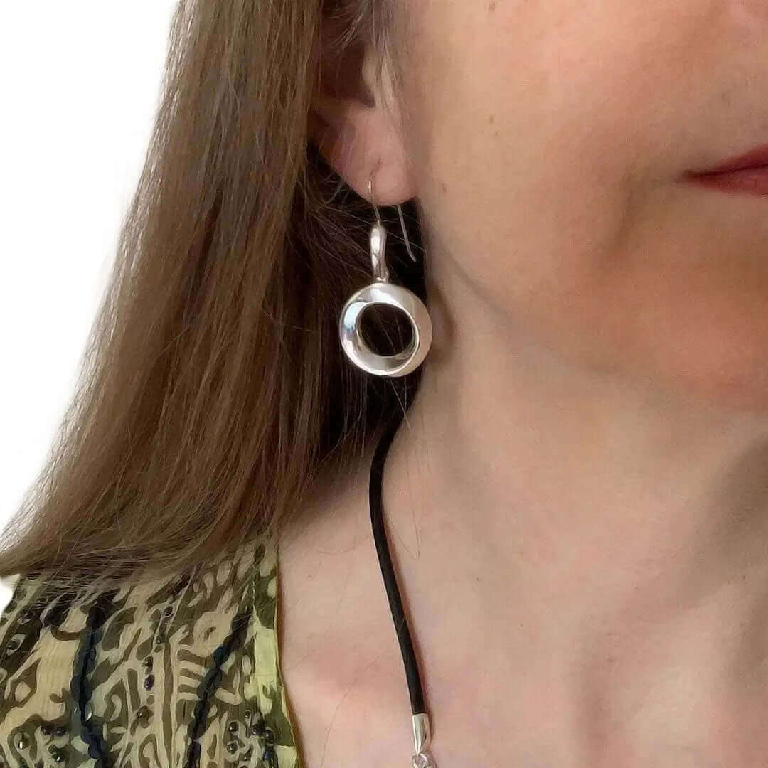 Circle Earrings In Silver with model - Nueve Sterling