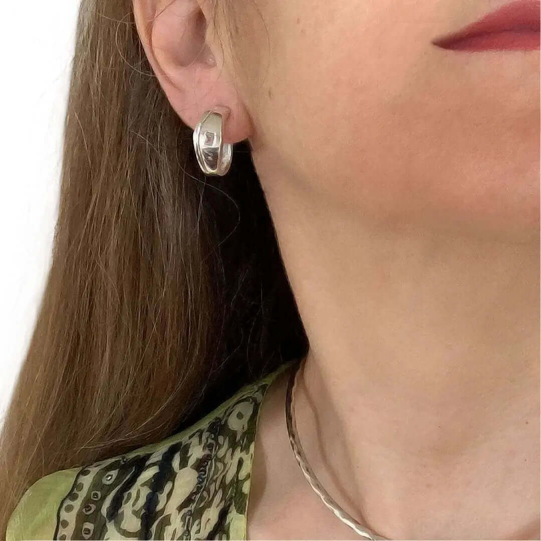 Curved Earrings In Silver With Zirconia with model - Nueve Sterling