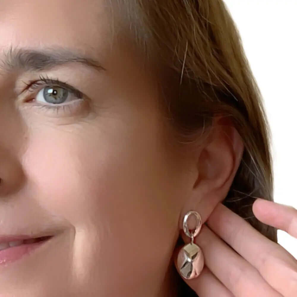 Dangling-Oval-Silver-Earrings-with-model