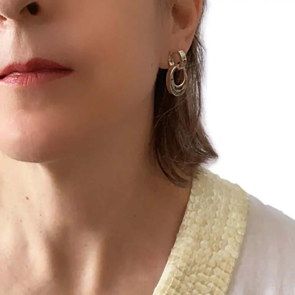 Dangling Oval Silver Post Earrings with model - Nueve Sterling