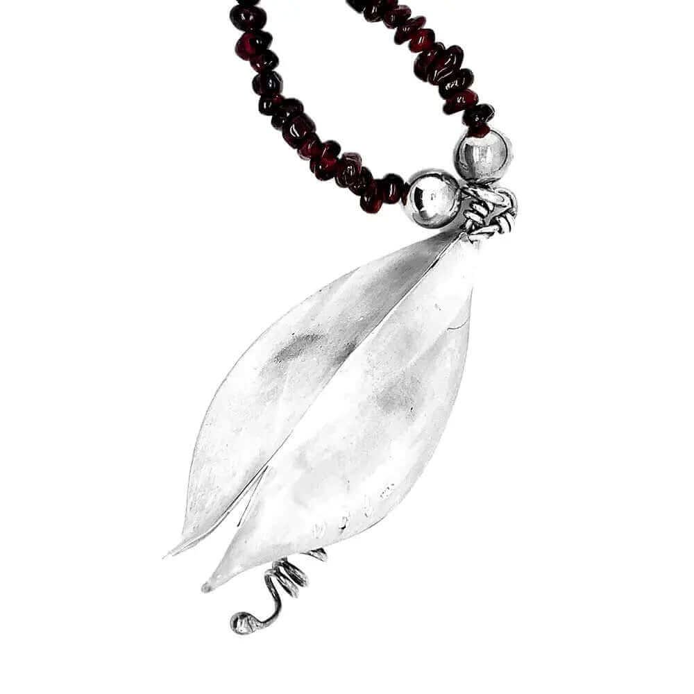 Back of silver pendant and garnet necklace