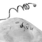 Close up of collection number of a silver piece